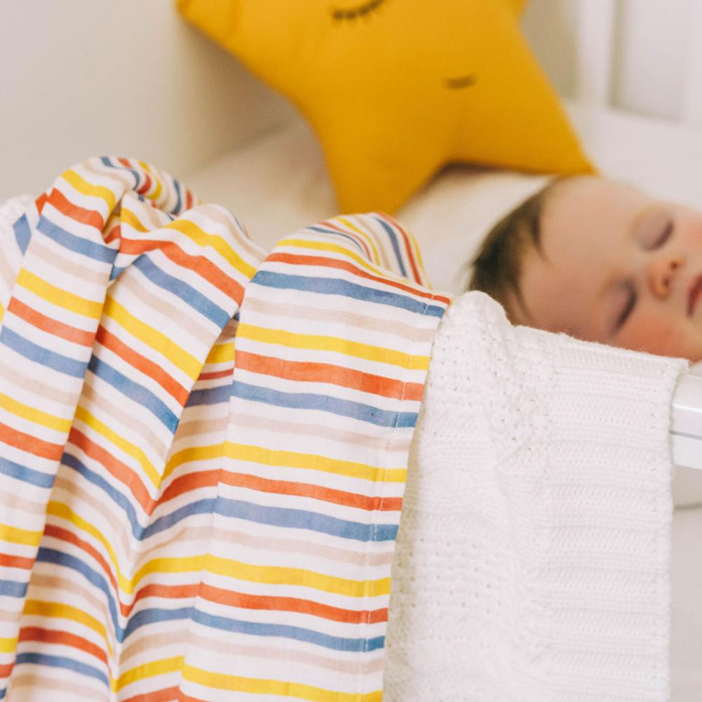 Rainbow stripe blanket and white knitted blanket